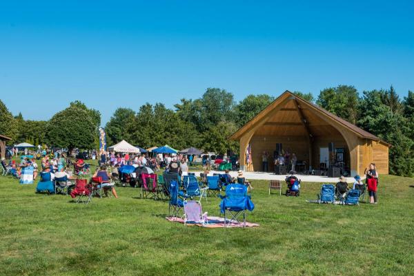 wooden amphitheater and crowd in front of stage